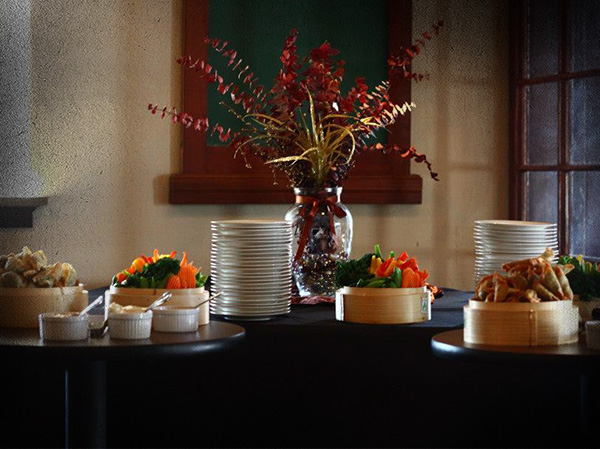 A beautiful arraingment of custom catered food for a business event.